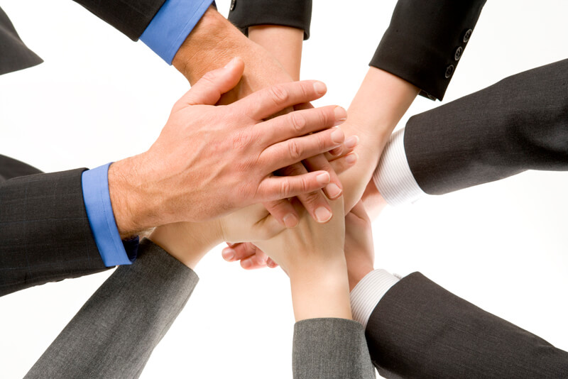 Businesspeople Hands In Together