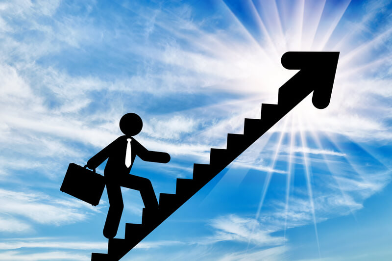 Businessman with briefcase walking up