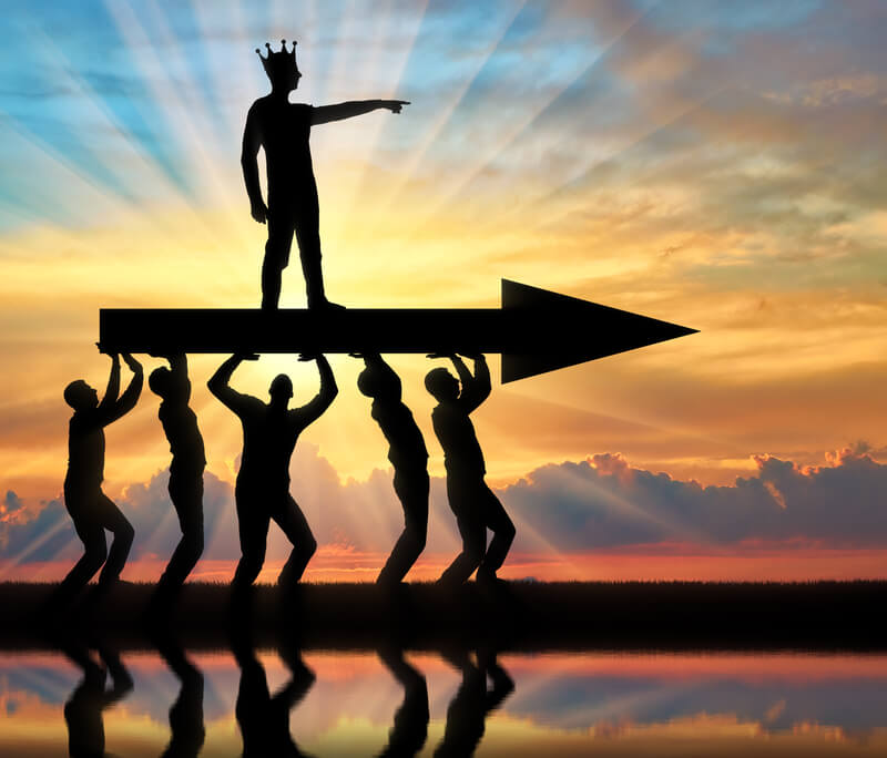 Concept of a selfish man with a crown on his head